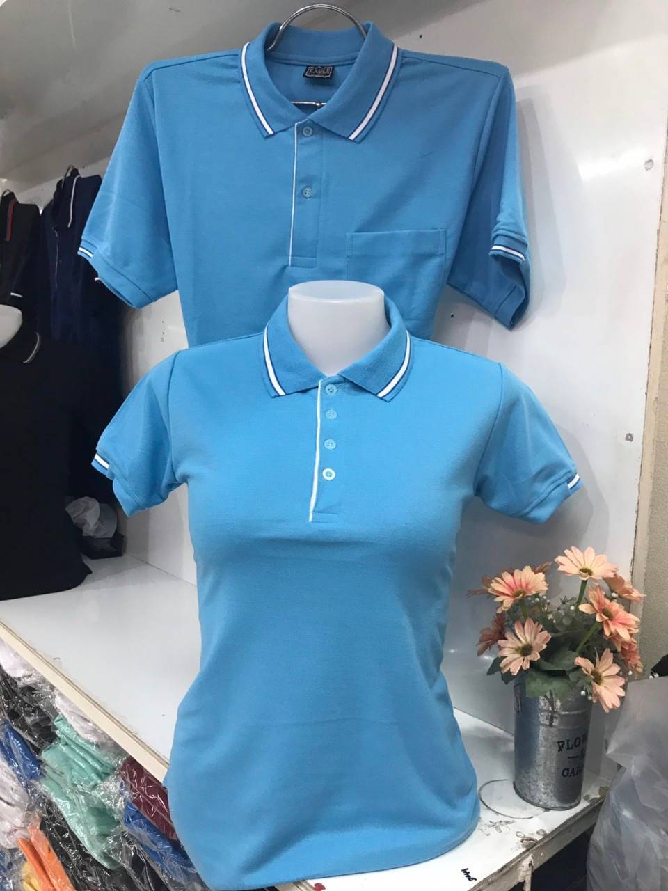 EG เสื้อโปโล สีฟ้าขลิบขาว