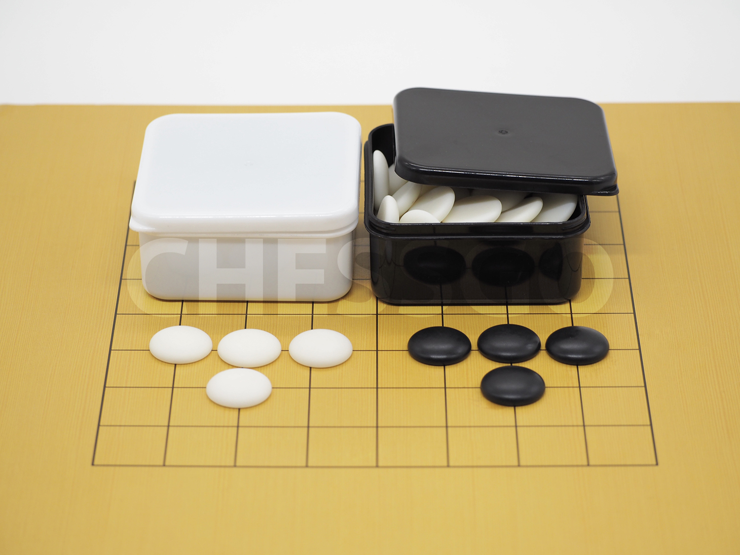 ชุดหมากล้อมไม้ (กระดานไม้บาง5mm-9เส้น+เม็ดนูน1ด้าน40/40เม็ด+โถขาวดำS)