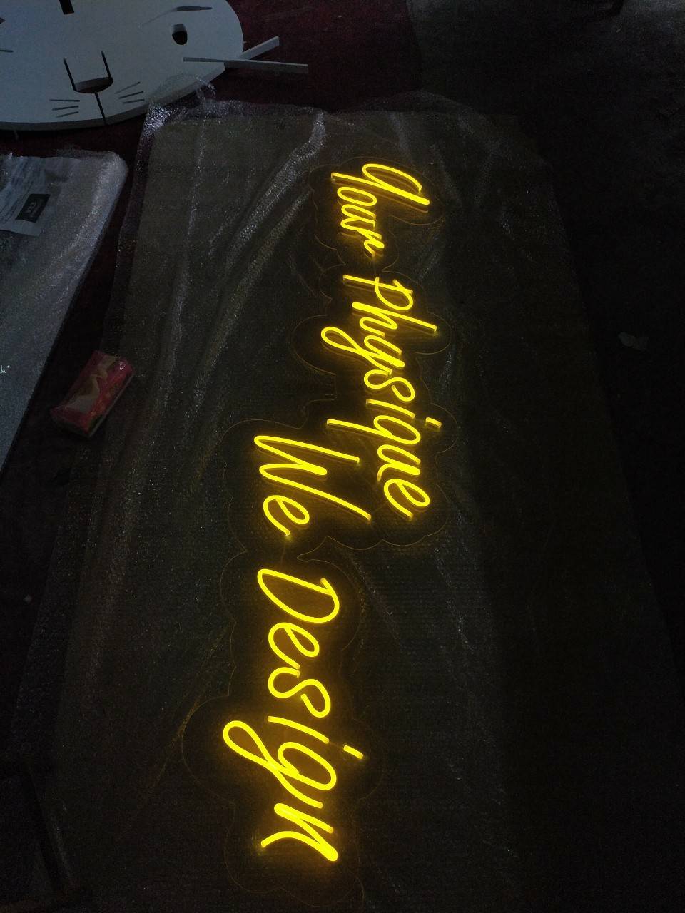ป้ายไฟนีออนดัด แสงสีเหลือง Your phgsique We Design #วางบนอะคริลิคใสไดคัทรองหลัง