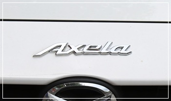 โลโก้ Axela Mazda 3